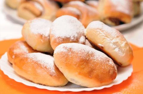 A stack of buns on a white plate Stock Photos