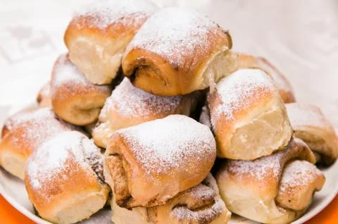 A stack of buns on a white plate Stock Photos