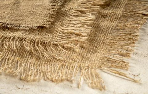 Stack of burlap napkins with fringe close-up, rustic style Stock Photos