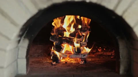 Stack of burning logs inside a wood fired fired pizza oven Stock Footage 204771960