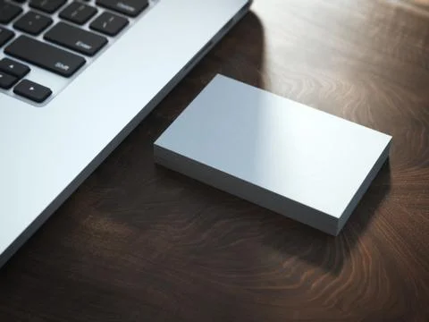 Stack of business cards on the table near laptop. Stock Illustration