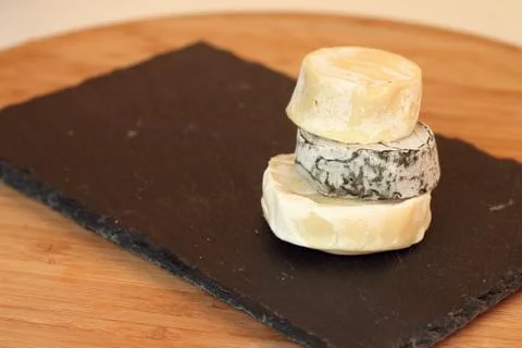 Stack of camembert cheese Stock Photos