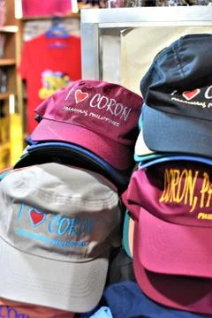 A stack of caps that are on display in a countryside gift shop Stock Photos