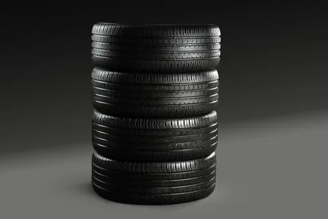 Stack of car tires on dark background Stock Photos