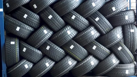 Stack of car tires on warehouse closeup Vidéo 143431937