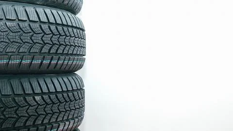 Stack car wheel winter tires isolated. New tyres. Place for text Stock Photos