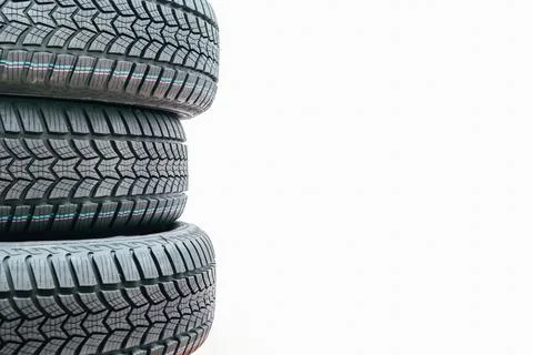 Stack car wheel winter tires isolated. New tyres. Place for text Stock Photos