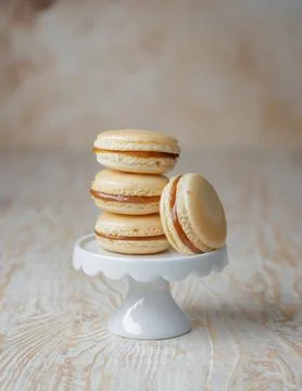 Stack of caramel macaroons on a stand Stock Photos