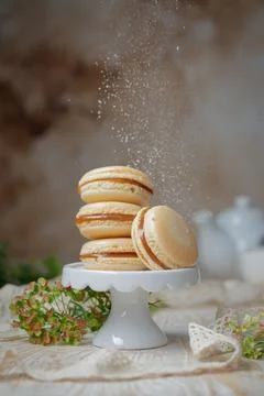 Stack of caramel macaroons on a stand Stock Photos