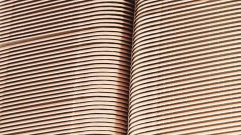 A stack of cardboard blanks for medicine packaging boxes stands on a producti Stock Photos