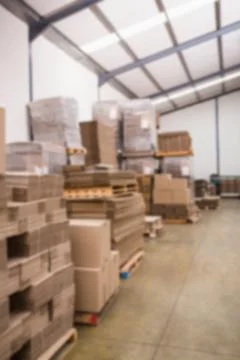 Stack of cardboard boxes against wall Stock Photos