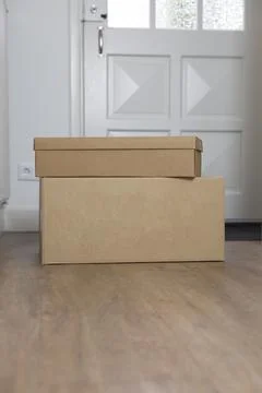 Stack of Cardboard boxes blank in the Hallway of new home on the floor. Moving Stock Photos