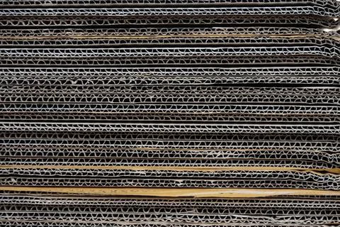Stack of Cardboard Boxes Creating a Textured Background Stock Photos