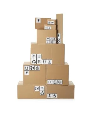 Stack of cardboard boxes with different packaging symbols on white background Stock Photos