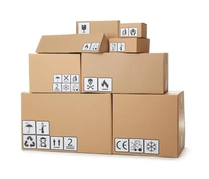 Stack of cardboard boxes with different packaging symbols on white background Stock Photos