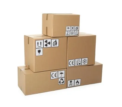 Stack of cardboard boxes with different packaging symbols on white background Stock Photos