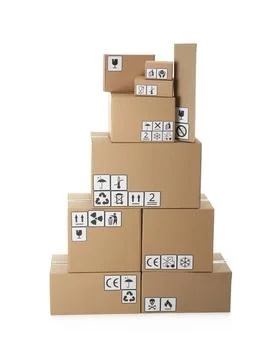 Stack of cardboard boxes with different packaging symbols on white background Stock Photos