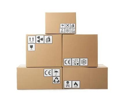 Stack of cardboard boxes with different packaging symbols on white background Stock Photos