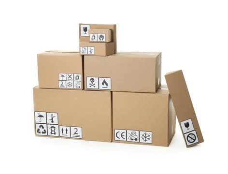 Stack of cardboard boxes with different packaging symbols on white background 스톡 사진