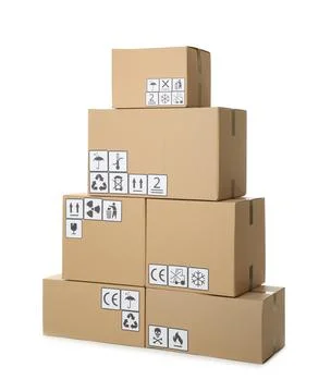 Stack of cardboard boxes with different packaging symbols on white background 스톡 사진