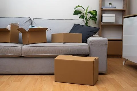 Stack of cardboard boxes, filled with home essentials, symbolizing the Stock-Fotos