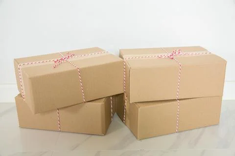 Stack of cardboard boxes for moving, Empty room with a white wall and cardboa Stock Photos
