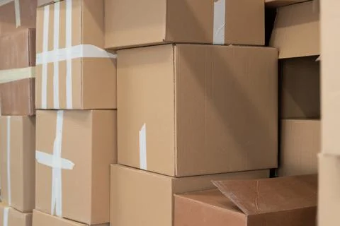 Stack of cardboard boxes ready to be shipped of a warehouse. Package storage Stock Photos