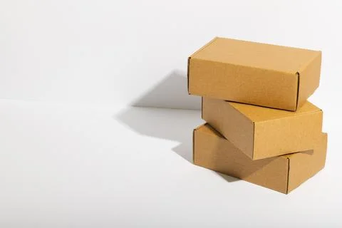 Stack of cardboard gift boxes with copy space over white background 스톡 사진