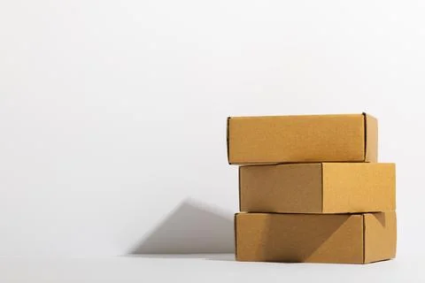 Stack of cardboard gift boxes with copy space over white background Foto stock