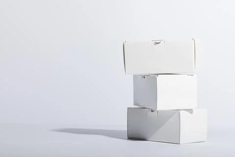 Stack of cardboard gift boxes with copy space over white background Foto stock