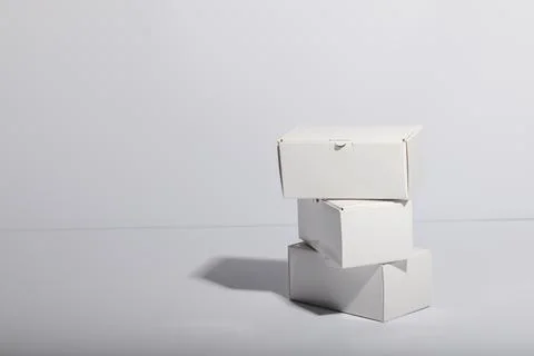 Stack of cardboard gift boxes with copy space over white background Foto stock