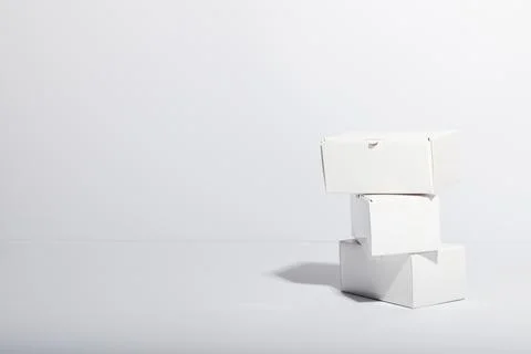 Stack of cardboard gift boxes with copy space over white background 스톡 사진