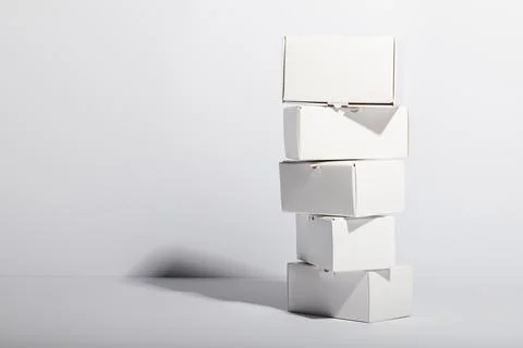 Stack of cardboard gift boxes with copy space over white background 스톡 사진