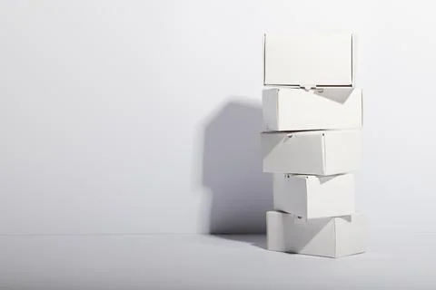 Stack of cardboard gift boxes with copy space over white background Foto stock