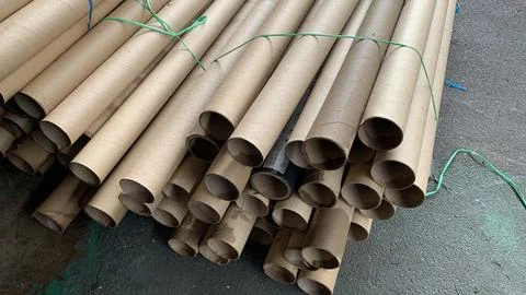 Stack of cardboard paper cores arranged for storage Stock Photos