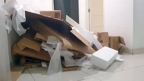 Stack of cardboard waste and styrofoam at home Video stock 112136549