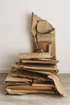 Stack of Cardboard Waste at home. Concepts of Paper Recycling and Waste So... Stock Photos