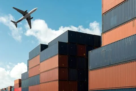 Stack of cargo containers with cargo airplane at import and export area at po Stock Photos