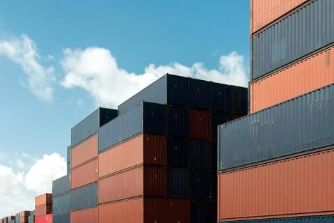 Stack of cargo containers at import and export area at port. Foto stock