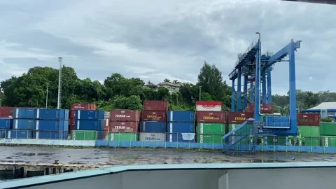 Stack of cargo containers at Sorong port. Stock Footage 320451179