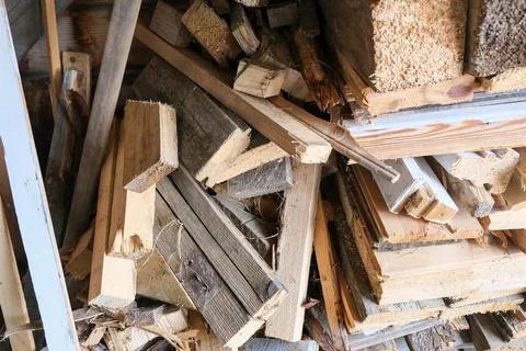 A stack of carpentery waste using as firewood, sustainable, rational and Stock Photos