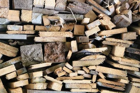 A stack of carpentery waste using as firewood, sustainable, rational and Stock Photos
