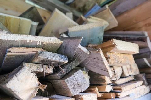 A stack of carpentery waste using as firewood, sustainable, rational and Stock Photos