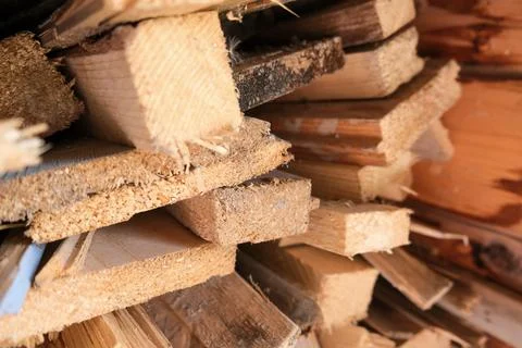 A stack of carpentery waste using as firewood, sustainable, rational and Stock Photos