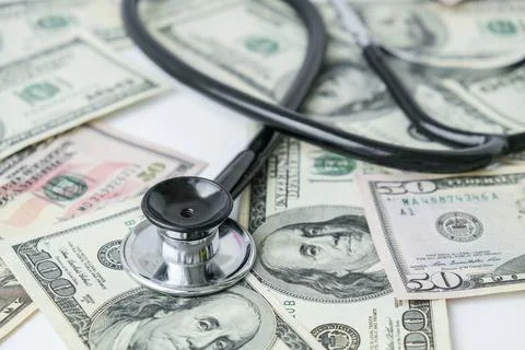 Stack of cash dollars and stethoscope. The concept of medical expensive medic 스톡 사진