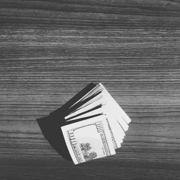 Stack of cash on a table. Stock Photos