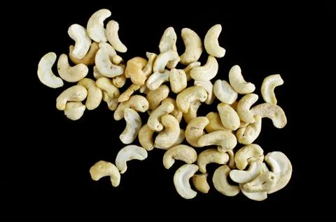 A stack of cashew nuts on the black background Foto stock