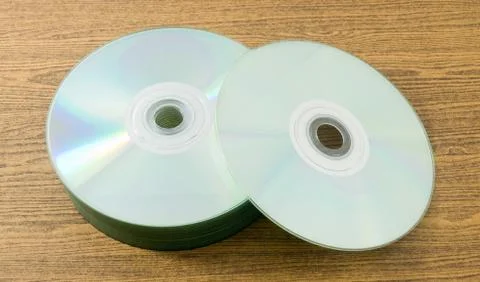A Stack of CD or DVD Compact Disc on A Wooden Table. Stock Photos