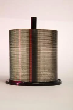 Stack of CD's on a spool Foto stock