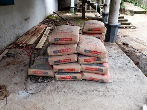 Stack of cement sacks at a construction site Stock Photos